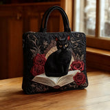 Handgefertigte Stepp-Tasche - Schwarze Katze auf Büchern